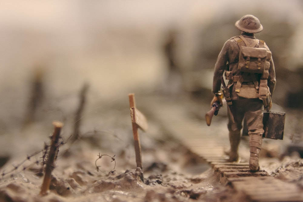 image of a soldier walking along a path